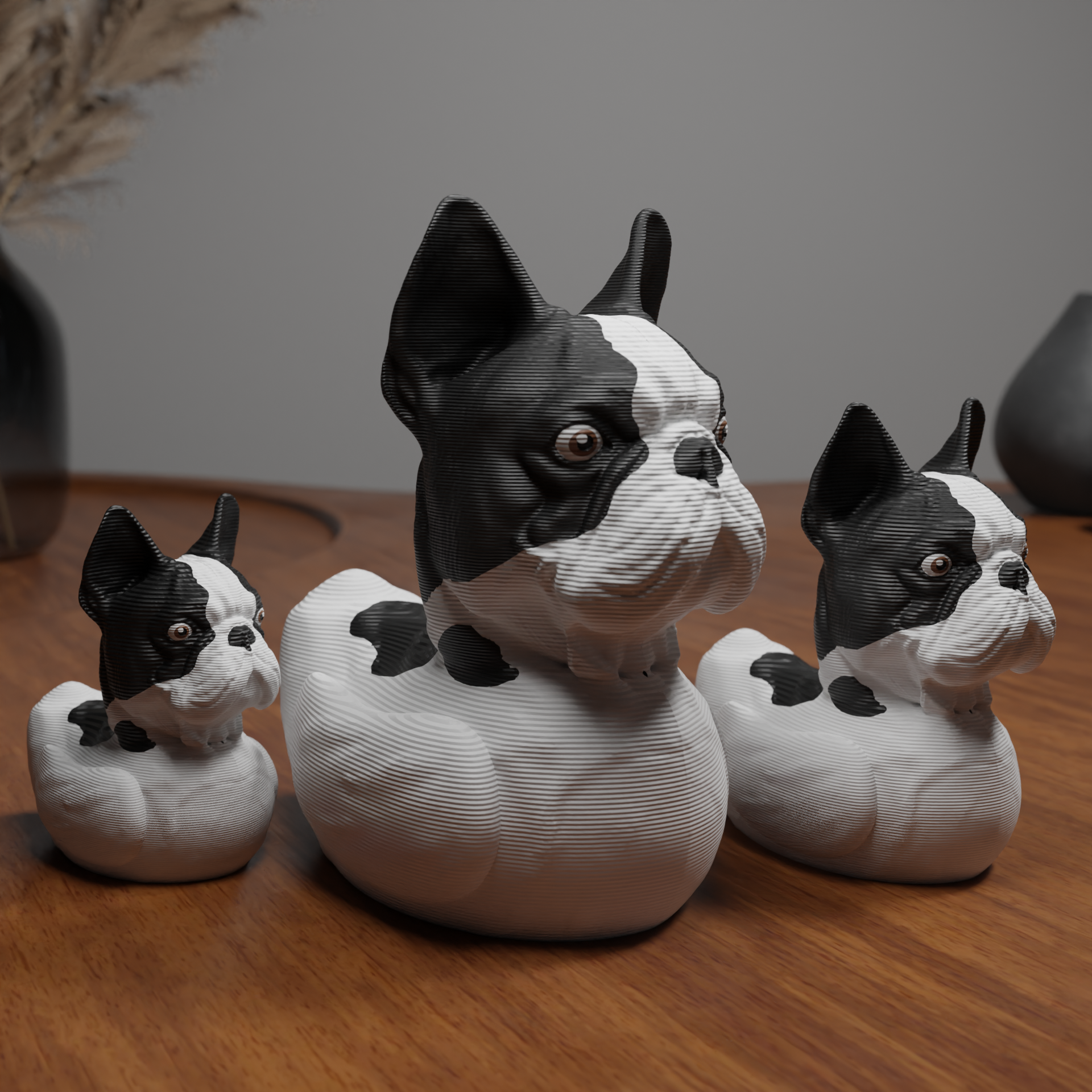 Small bulldog duck figurine placed next to a computer, miniature animal decoration and funny bulldog duck gift for office desk workspace