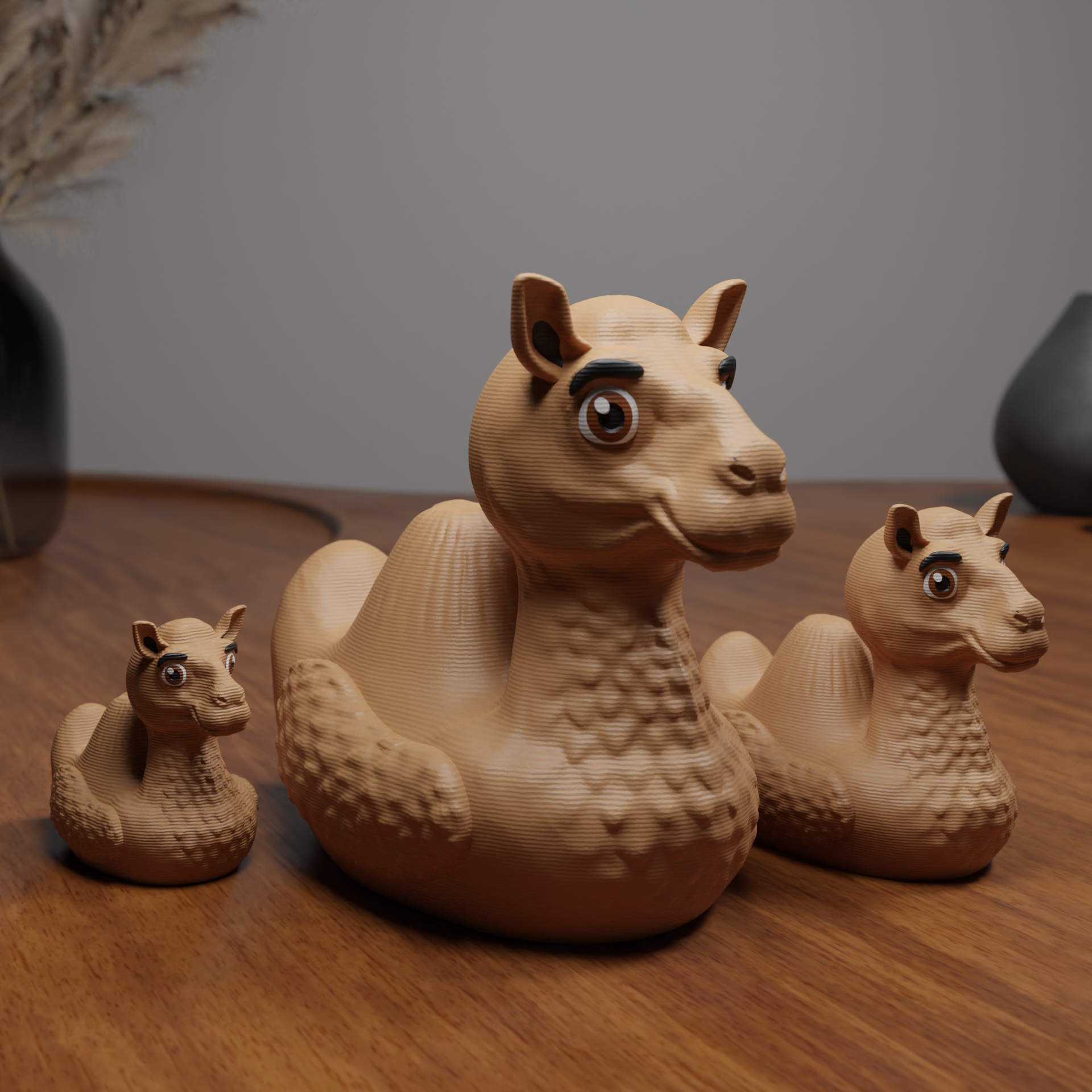 Small Camel Duck figurine placed next to a computer, animal-themed miniature decoration and funny Camel Duck gift for office desk workspace