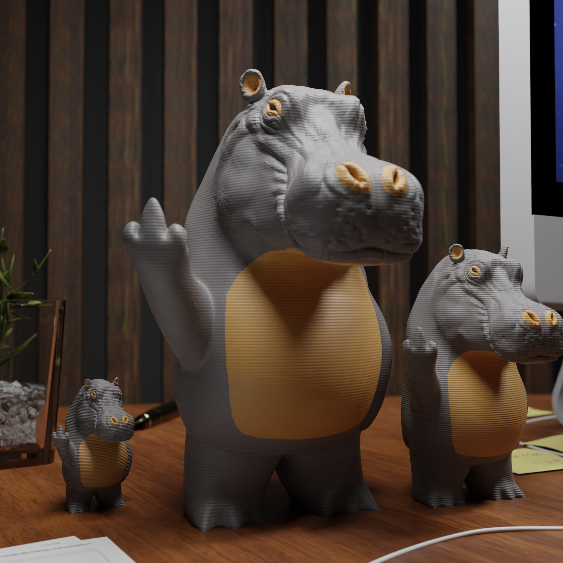 Small hippo figurine placed next to a computer, miniature wild animal decoration and funny hippo gift for office desk workspace