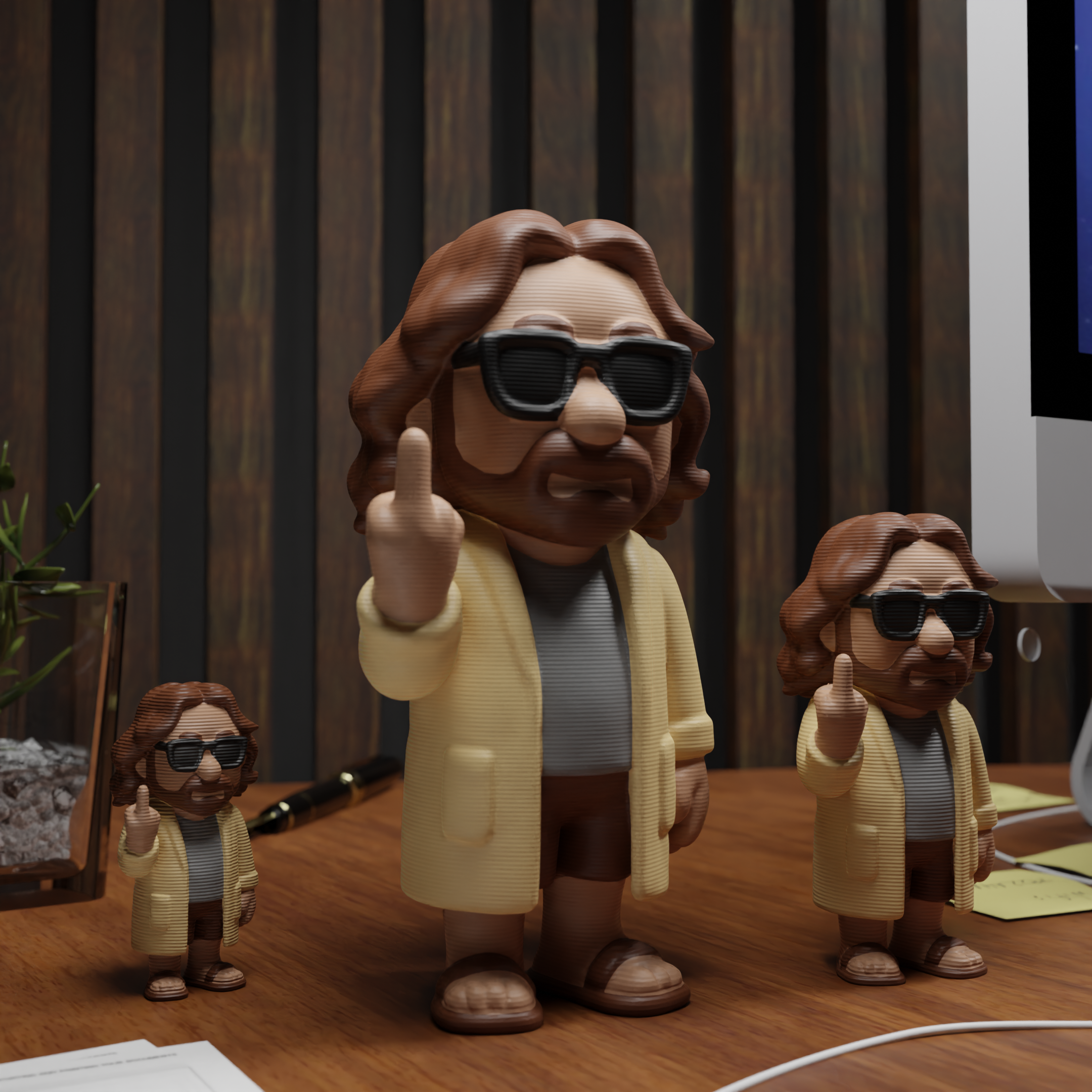 Small The Dude figurine placed next to a computer, funny miniature decoration and geeky movie gift for office desk or workspace