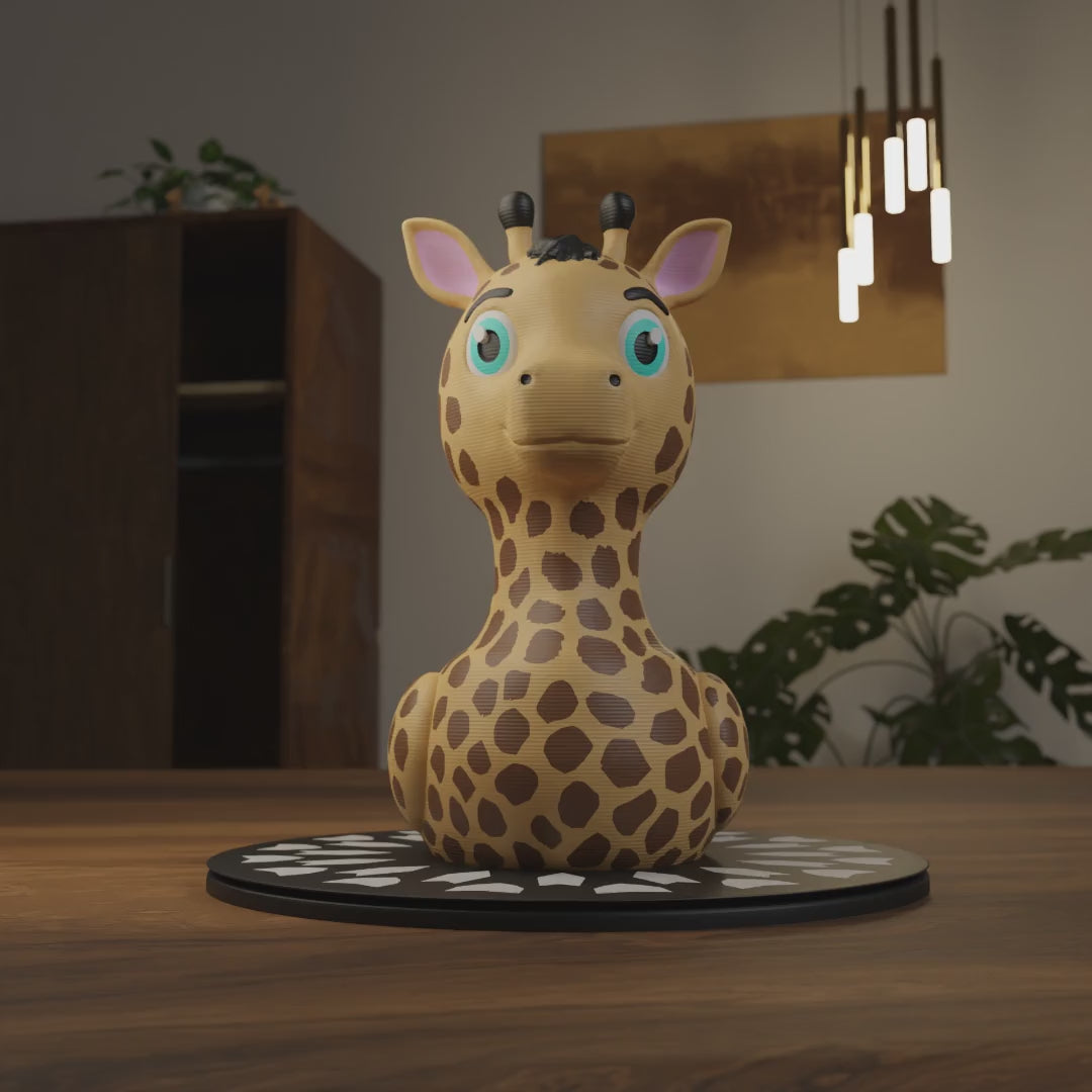 Small Giraffe Duck figurine placed next to a computer, animal-themed miniature decoration and funny Giraffe Duck gift for office desk workspace