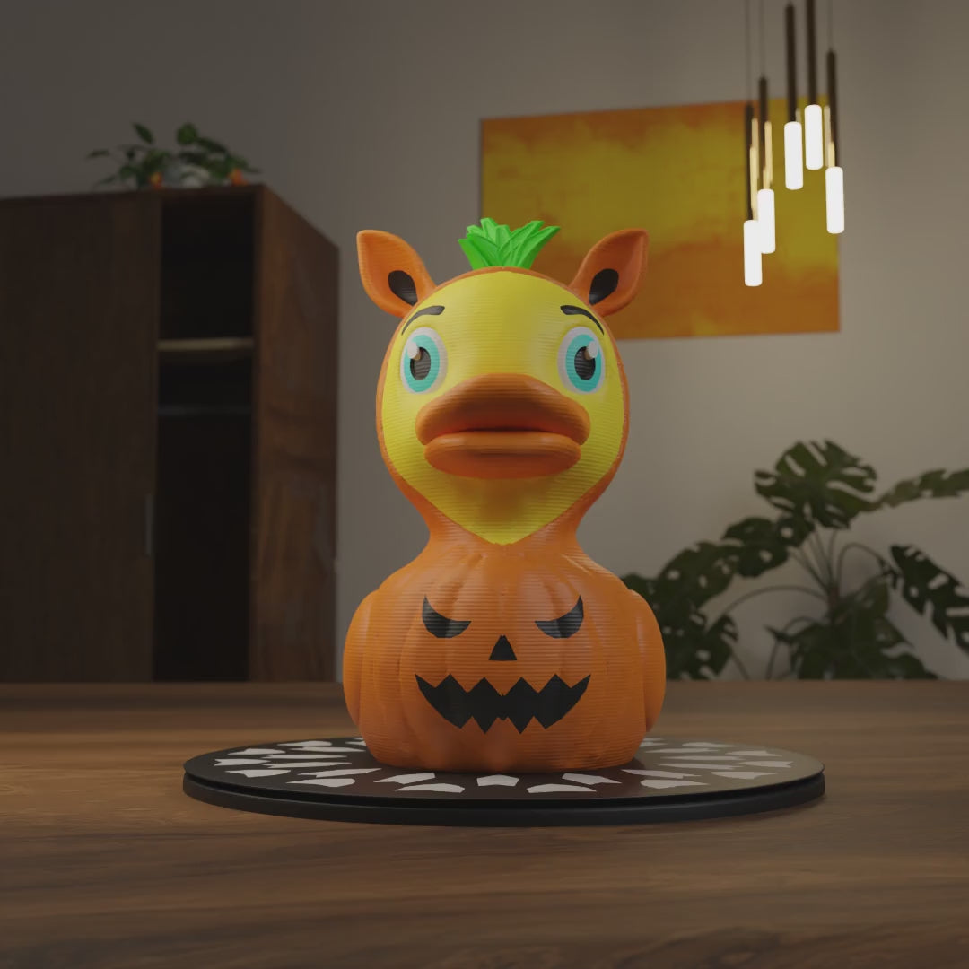 Small Pumpkin Duck figurine on a coffee table, cute spooky miniature decoration and funny Pumpkin Duck gift for living room or lounge decor