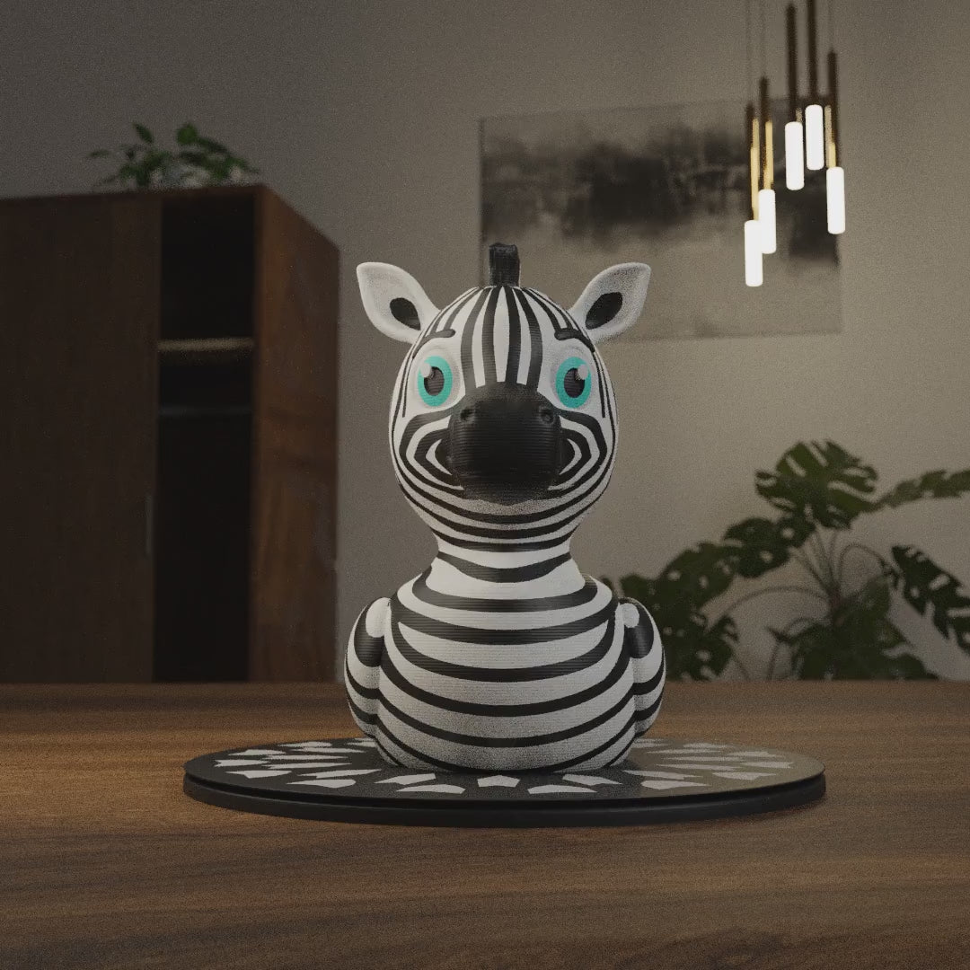 Small Zebra Duck figurine on a desk, funny miniature animal decoration and unique duck gift for office or home workspace
