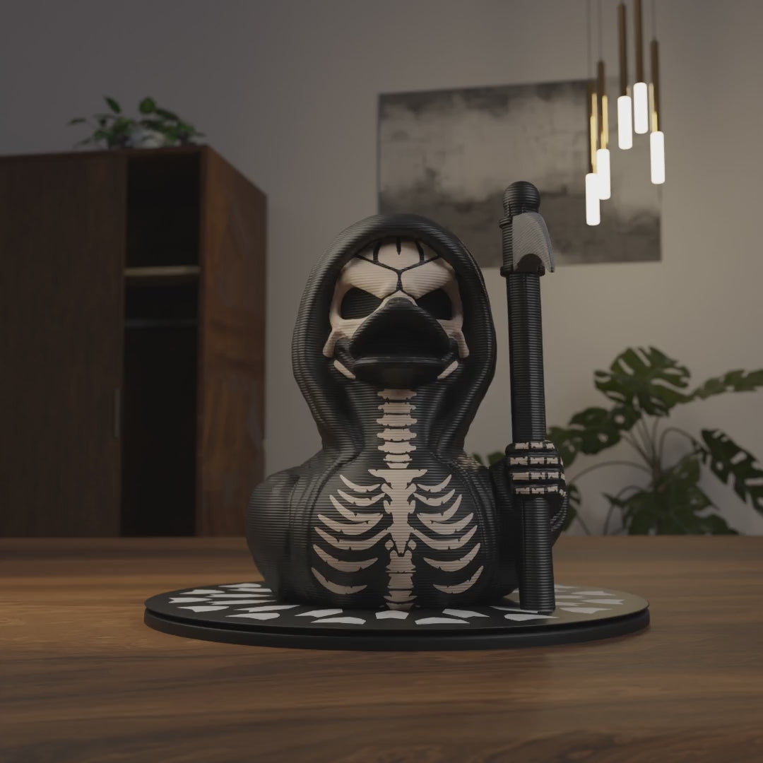 Small Reaper Duck figurine displayed on a closet, spooky miniature decoration and quirky duck gift for stylish home interior